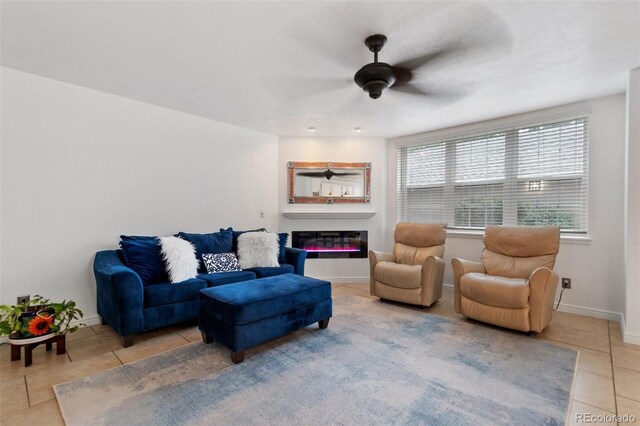 tiled living room with ceiling fan and a healthy amount of sunlight