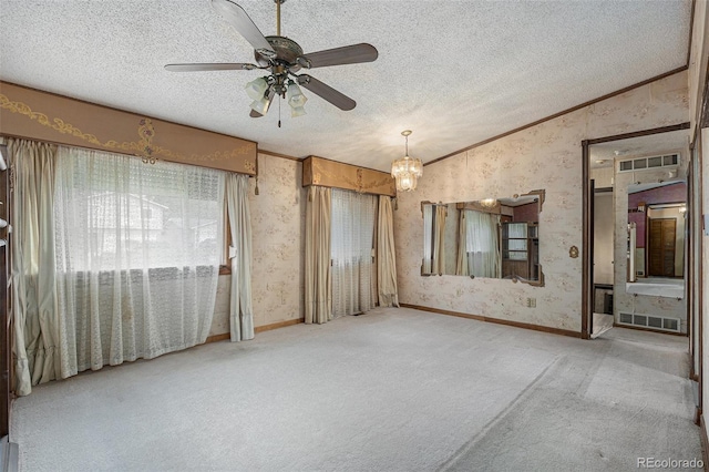 1401 S Paris Ct, Aurora, CO 80012 - carpeted spare room featuring lofted ceiling, wallpapered walls, a textured ceiling, a ceiling fan, and a chandelier