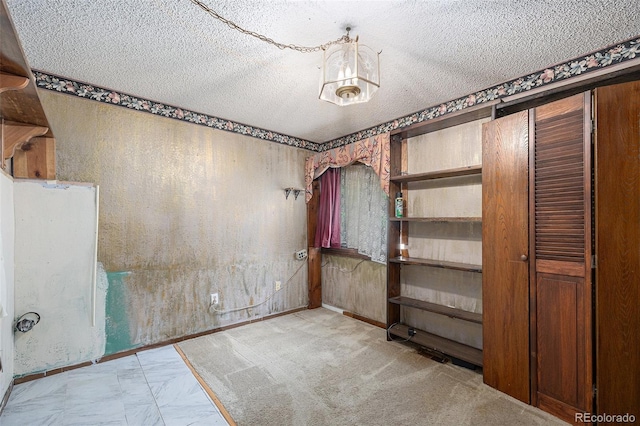 1401 S Paris Ct, Aurora, CO 80012 - unfurnished room featuring a textured ceiling and wallpapered walls