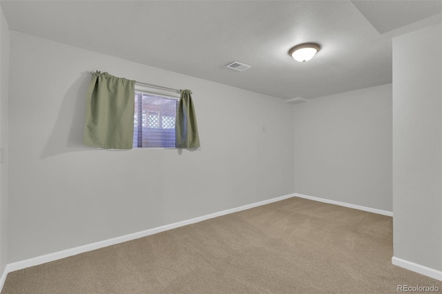 14463 E Wagon Trail Pl, Aurora, CO 80015 - spare room featuring carpet floors and baseboards