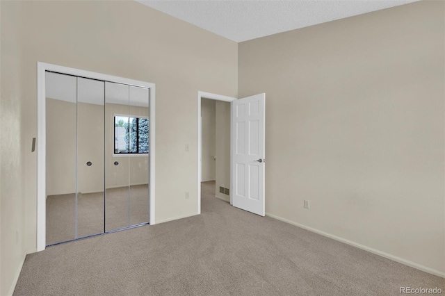 14463 E Wagon Trail Pl, Aurora, CO 80015 - unfurnished bedroom featuring carpet floors and a closet