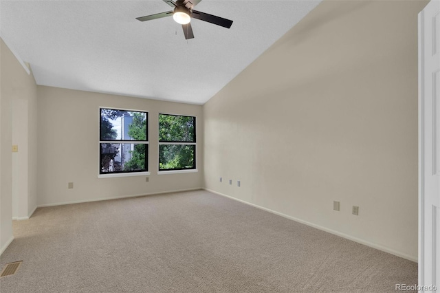 14463 E Wagon Trail Pl, Aurora, CO 80015 - spare room featuring a ceiling fan, carpet flooring, and vaulted ceiling