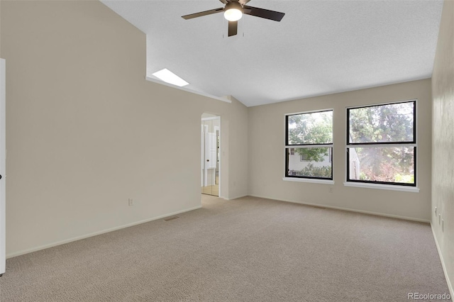 14463 E Wagon Trail Pl, Aurora, CO 80015 - unfurnished room featuring ceiling fan, lofted ceiling, and light colored carpet
