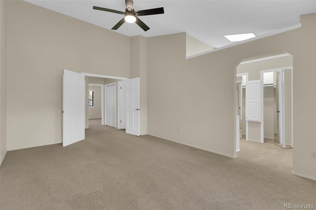 14463 E Wagon Trail Pl, Aurora, CO 80015 - carpeted spare room with ceiling fan and arched walkways