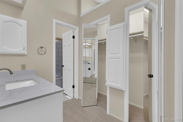 14463 E Wagon Trail Pl, Aurora, CO 80015 - bathroom featuring vanity and a spacious closet