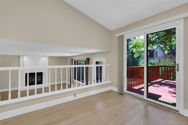 14463 E Wagon Trail Pl, Aurora, CO 80015 - spare room with wood finished floors and high vaulted ceiling