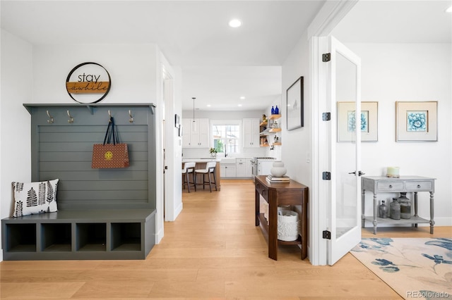 8357 W 68th Ln, Arvada, CO 80004 - mudroom featuring light wood finished floors and recessed lighting
