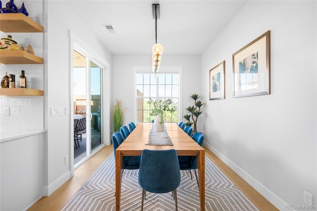 8357 W 68th Ln, Arvada, CO 80004 - dining space featuring light wood-type flooring and baseboards