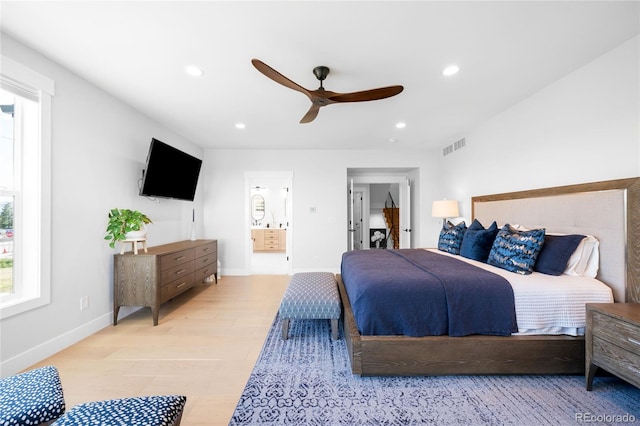 8357 W 68th Ln, Arvada, CO 80004 - bedroom featuring recessed lighting, wood finished floors, ensuite bathroom, baseboards, and a ceiling fan