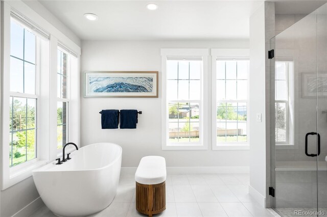8357 W 68th Ln, Arvada, CO 80004 - full bathroom with healthy amount of natural light, baseboards, a soaking tub, and recessed lighting
