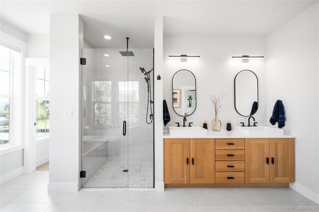 8357 W 68th Ln, Arvada, CO 80004 - full bathroom featuring a stall shower, double vanity, baseboards, recessed lighting, and tile patterned flooring