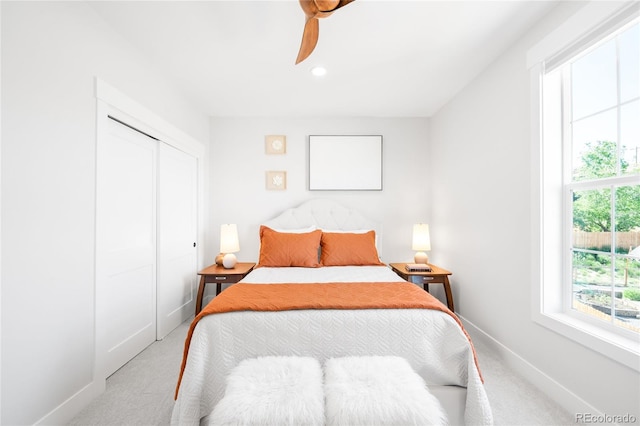 8357 W 68th Ln, Arvada, CO 80004 - bedroom featuring light colored carpet, baseboards, a closet, a ceiling fan, and recessed lighting