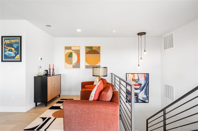 8357 W 68th Ln, Arvada, CO 80004 - living area with light wood-style floors, baseboards, and recessed lighting