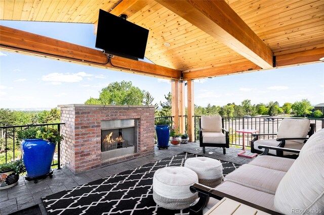 8357 W 68th Ln, Arvada, CO 80004 - view of patio / terrace featuring an outdoor brick fireplace and a gazebo