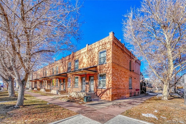 view of front of house with brick siding