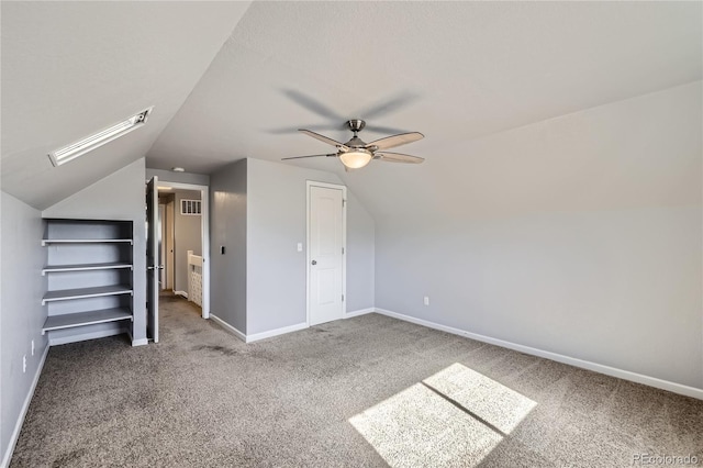 additional living space with baseboards, a ceiling fan, carpet flooring, and lofted ceiling