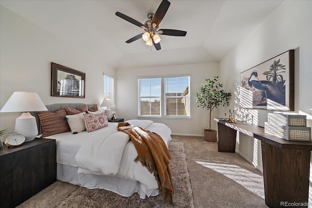 bedroom featuring ceiling fan, vaulted ceiling, and light colored carpet