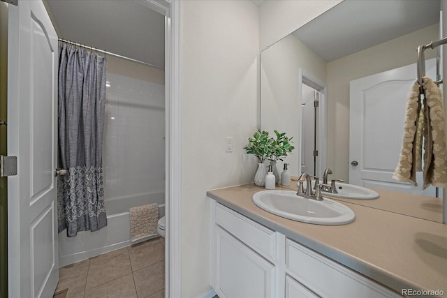 full bathroom with toilet, tile patterned flooring, shower / bathtub combination with curtain, and vanity