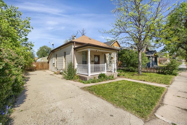 2415 Chase St, Edgewater, CO 80214 - view of side of home with covered porch and concrete driveway