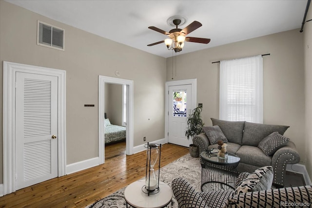 2415 Chase St, Edgewater, CO 80214 - living area with hardwood / wood-style floors, ceiling fan, and baseboards