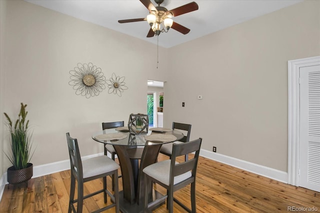 2415 Chase St, Edgewater, CO 80214 - dining space featuring ceiling fan, baseboards, wood-type flooring, and vaulted ceiling