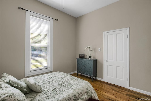 2415 Chase St, Edgewater, CO 80214 - bedroom featuring baseboards, multiple windows, and wood finished floors
