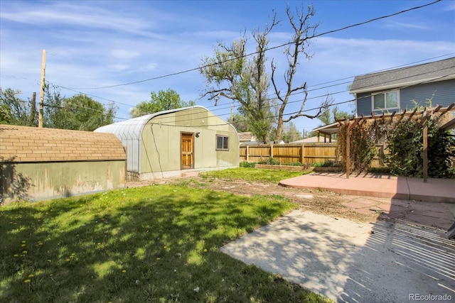 2415 Chase St, Edgewater, CO 80214 - view of yard featuring a patio area and an outbuilding