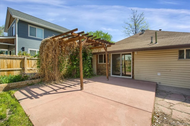 2415 Chase St, Edgewater, CO 80214 - rear view of house featuring a pergola, fence, a patio area, and roof with shingles