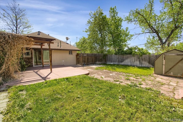 2415 Chase St, Edgewater, CO 80214 - view of yard with a storage shed, a patio area, and an outdoor structure