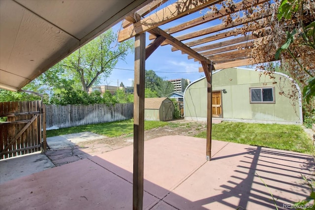 2415 Chase St, Edgewater, CO 80214 - view of patio featuring a shed, an outdoor structure, a pergola, and a gate