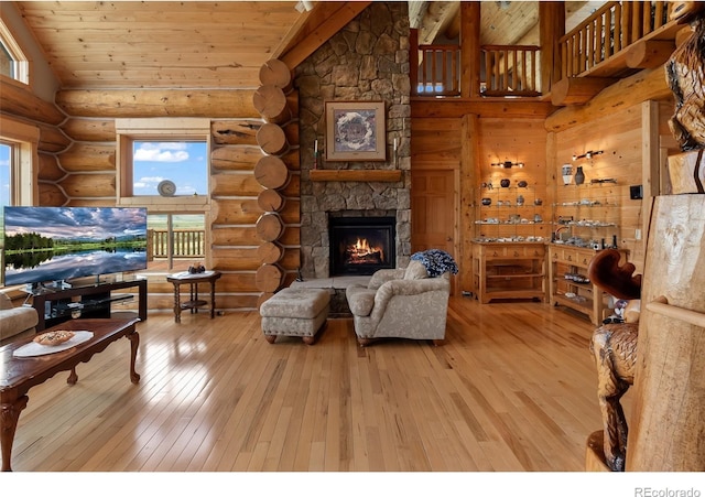 1000 N County Road 33, Como, CO 80432 - living area with wooden ceiling, rustic walls, plenty of natural light, hardwood / wood-style flooring, and a fireplace