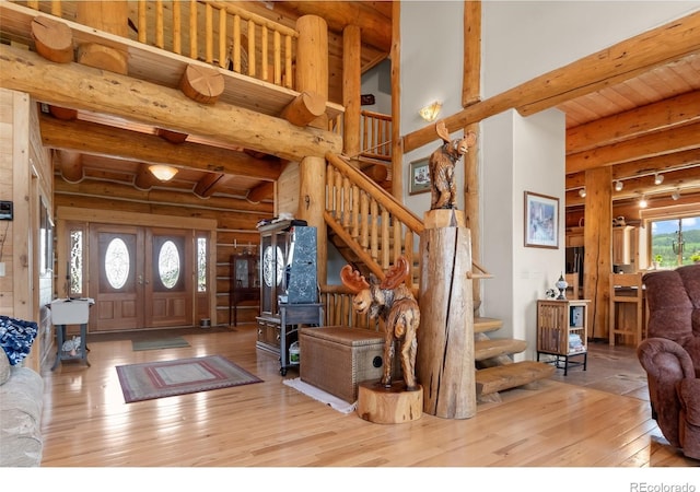1000 N County Road 33, Como, CO 80432 - entryway featuring hardwood / wood-style floors, stairs, rustic walls, and a wood ceiling with exposed beams