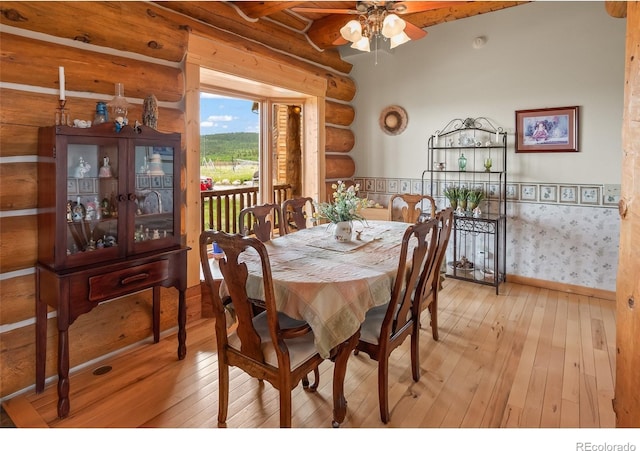 1000 N County Road 33, Como, CO 80432 - dining room featuring hardwood / wood-style flooring, ceiling fan, and log walls
