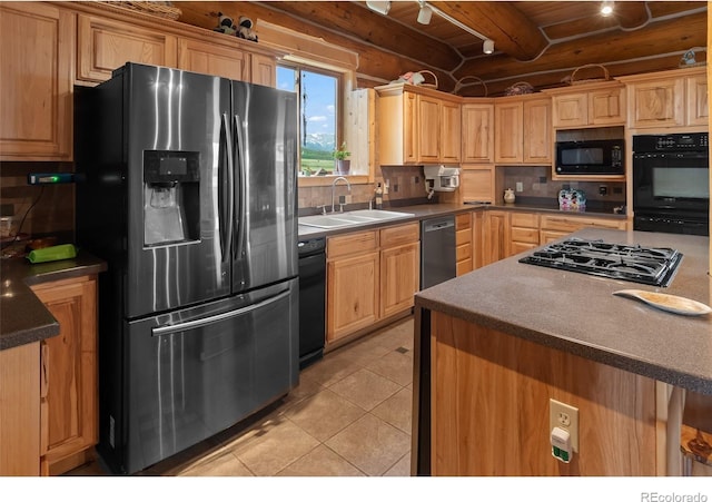 1000 N County Road 33, Como, CO 80432 - kitchen with black appliances, light tile patterned flooring, tasteful backsplash, light brown cabinets, and a wood ceiling with exposed beams