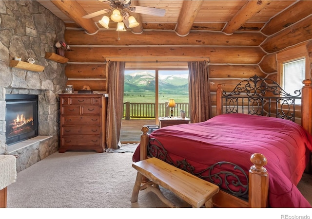 1000 N County Road 33, Como, CO 80432 - bedroom featuring a wood ceiling with exposed beams, access to exterior, rustic walls, a fireplace, and carpet floors