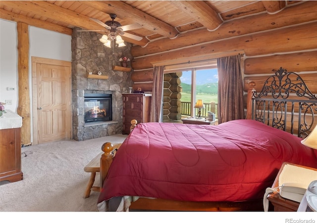 1000 N County Road 33, Como, CO 80432 - carpeted bedroom featuring log walls, access to exterior, a wood ceiling with exposed beams, and a stone fireplace