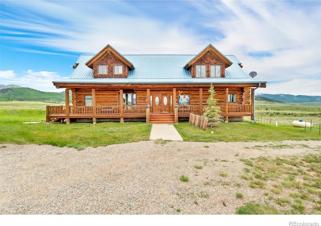 1000 N County Road 33, Como, CO 80432 - cabin featuring log exterior, covered porch, a metal roof, and a mountain view