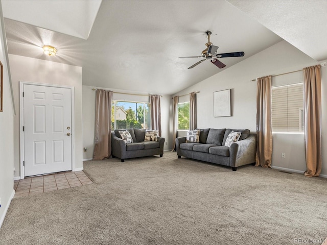 12555 Eastlake Dr, Thornton, CO 80241 - carpeted living room featuring vaulted ceiling, ceiling fan, and tile patterned flooring