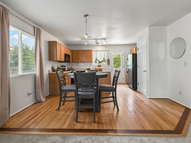 12555 Eastlake Dr, Thornton, CO 80241 - dining room featuring light wood finished floors