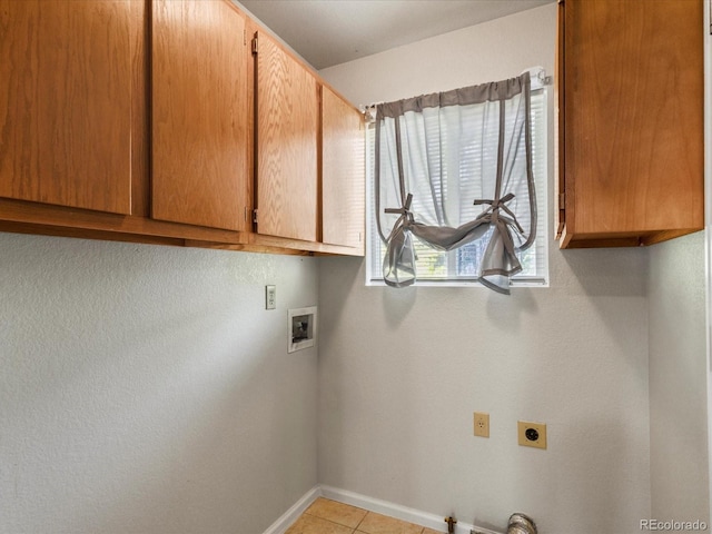 12555 Eastlake Dr, Thornton, CO 80241 - laundry area with hookup for an electric dryer, cabinet space, hookup for a washing machine, gas dryer hookup, and light tile patterned floors