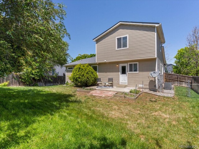 12555 Eastlake Dr, Thornton, CO 80241 - rear view of house with a patio and a fenced backyard