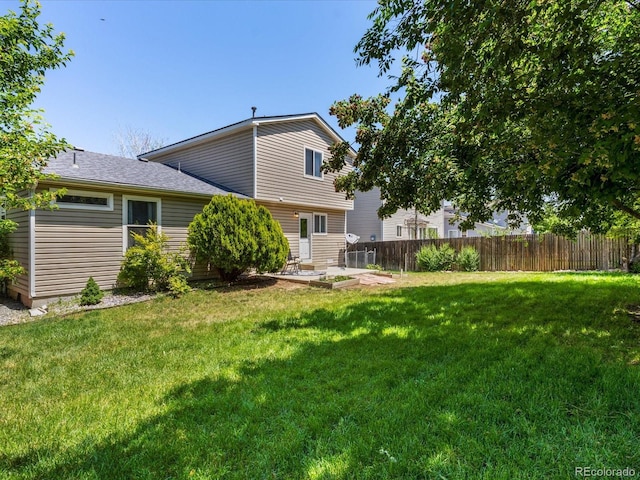 12555 Eastlake Dr, Thornton, CO 80241 - rear view of house featuring a patio area and a shingled roof