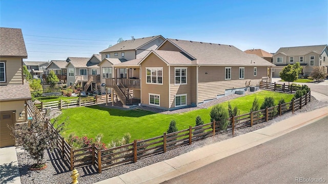 22891 E Union Cir, Aurora, CO 80015 - view of building exterior featuring a residential view, a fenced backyard, and stairs