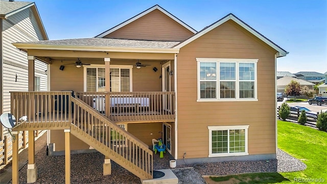 22891 E Union Cir, Aurora, CO 80015 - back of house featuring a ceiling fan, stairs, a deck, roof with shingles, and a lawn