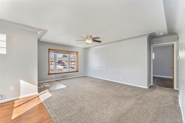 empty room featuring hardwood / wood-style floors and ceiling fan