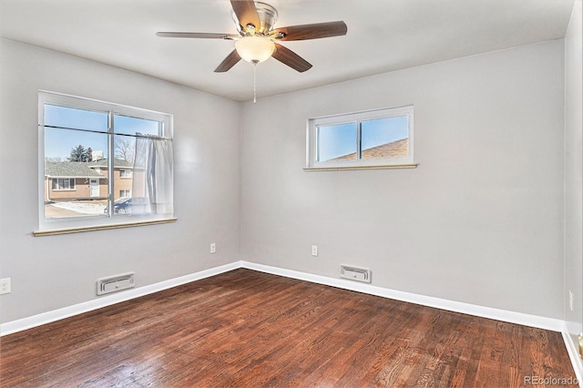 spare room featuring wood-type flooring and ceiling fan