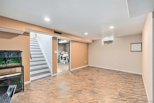 basement featuring separate washer and dryer