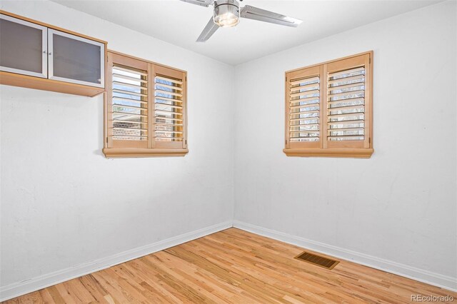 1335 Jasmine St, Denver, CO 80220 - spare room featuring wood finished floors and a ceiling fan
