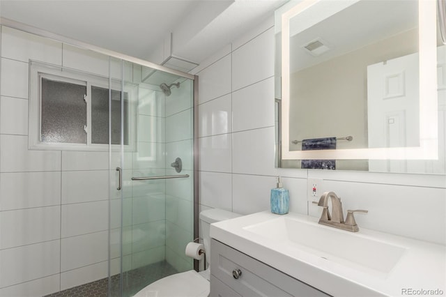 3841 W Quinn Pl, Denver, CO 80236 - full bath featuring tile walls, vanity, and a shower stall