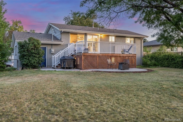 3841 W Quinn Pl, Denver, CO 80236 - rear view of property featuring a patio area, brick siding, stairway, and a yard